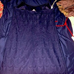 The dress is very form fitting it is dark blue